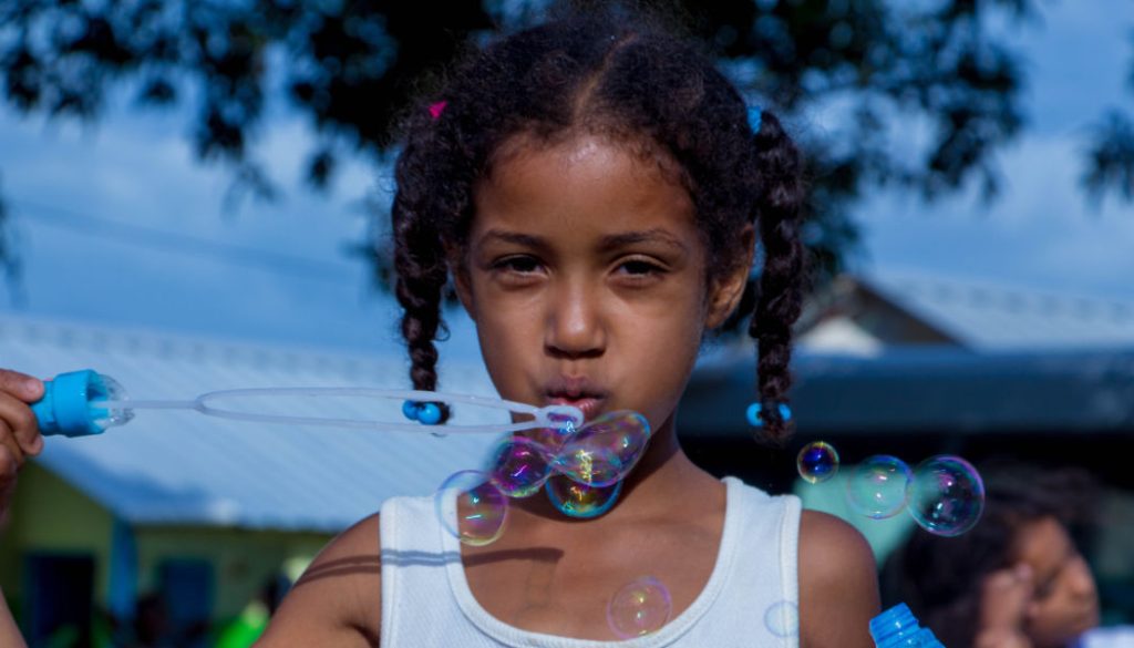 girl-blowing-bubbles12x6