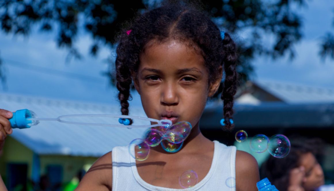 girl-blowing-bubbles12x6